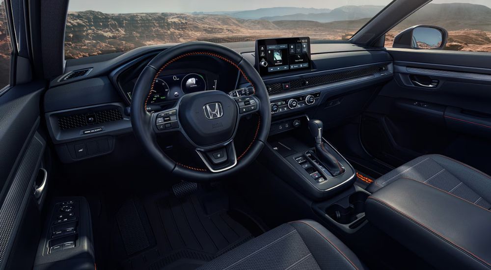 Black interior of a 2027 Honda CR-V TrailSport Hybrid.
