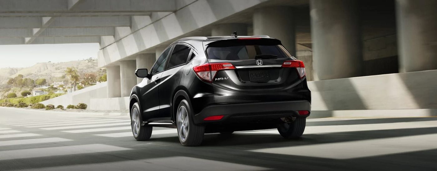 Rear of a black 2021 Honda HR-V driving beneath a tunnel.