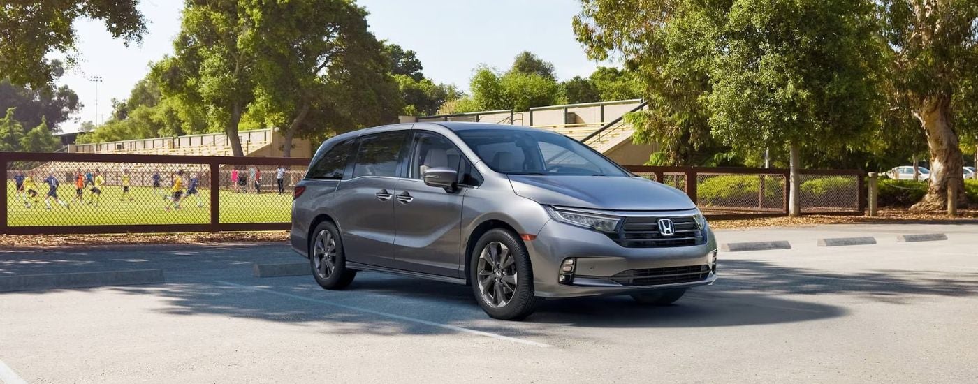 Grey 2026 Honda Odyssey parked on a parking lot.