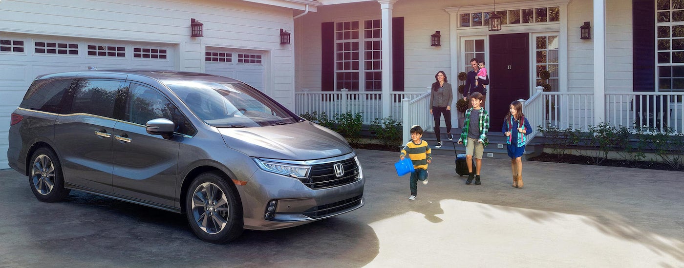 Grey 2026 Honda Odyssey parked on a driveway.