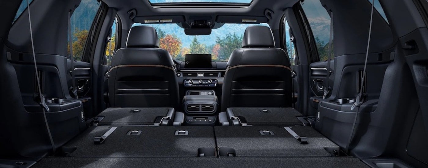 The black interior of a 2025 Honda Pilot from the rear.