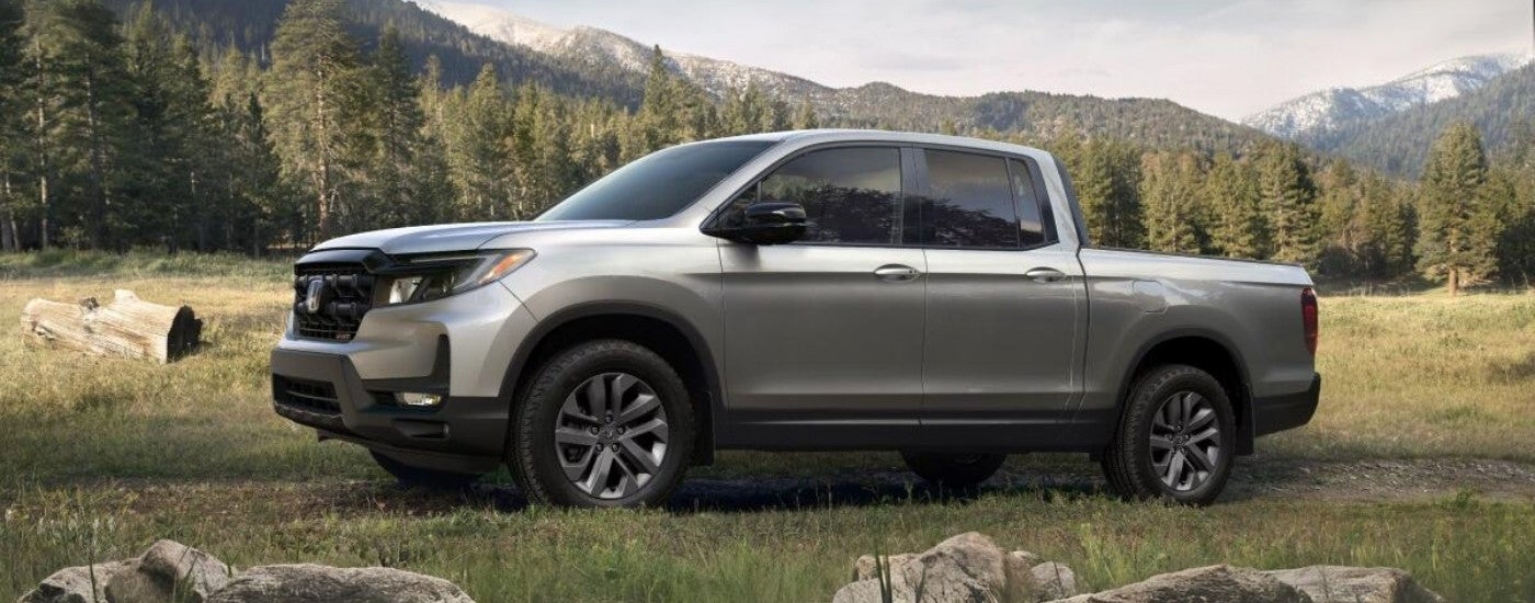 Silver 2025 Honda Ridgeline Sport parked off-road