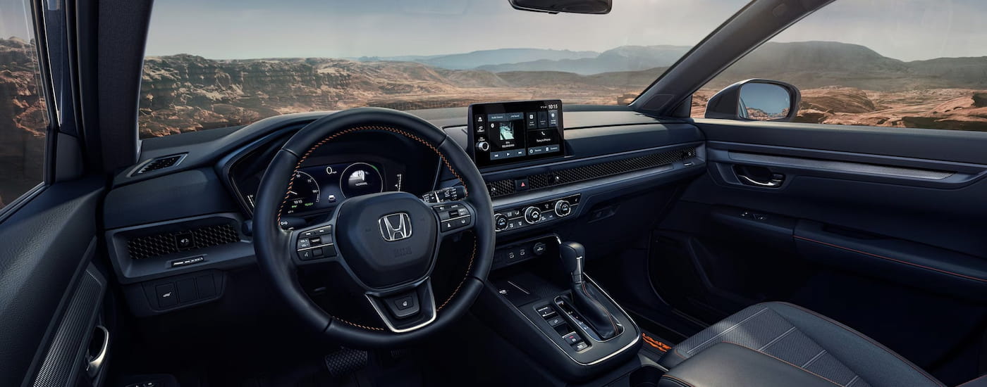 Steering wheel and dashboard of a 2026 Honda CR-V Hybrid.