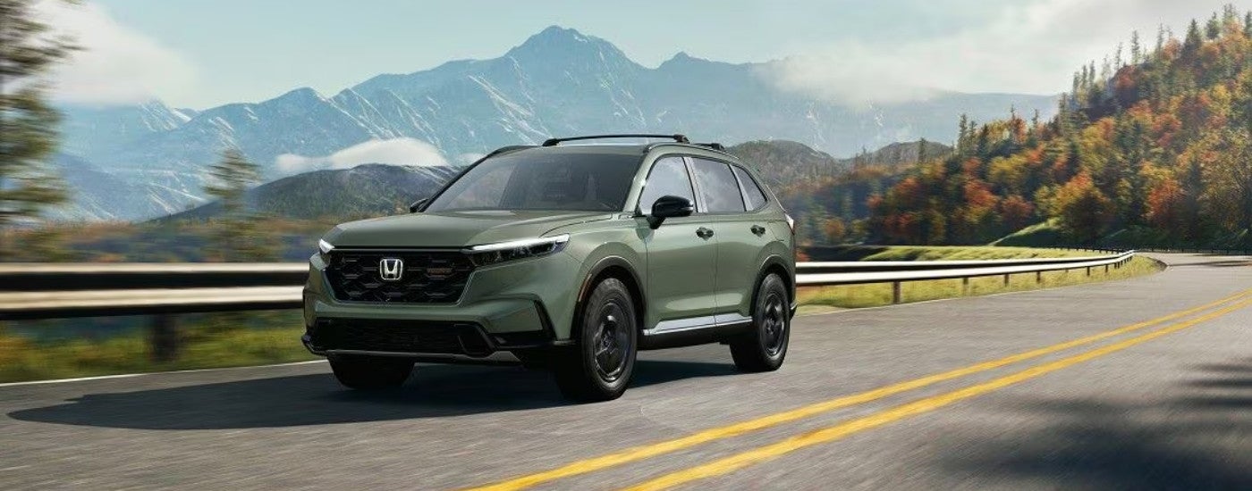 A green 2025 Honda CR-V for sale from the front at an angle.