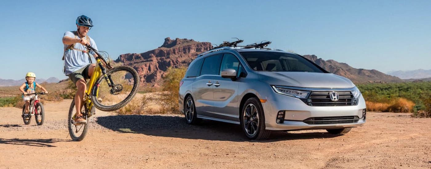 A silver 2022 Honda Odyssey from the front.