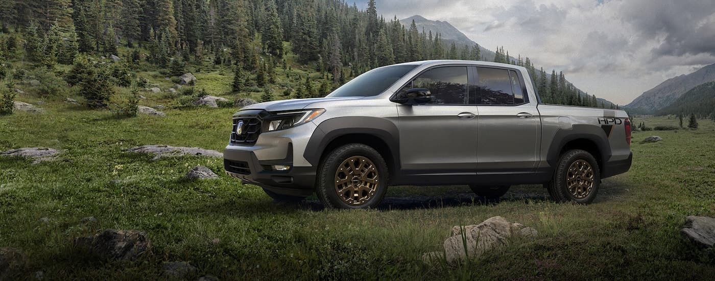 A silver 2024 Honda Ridgeline from the side.